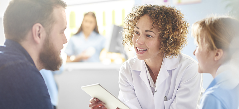 Doctor and translator talking with patient